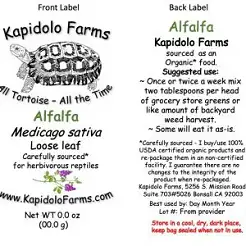 Front and back label for Kapidolo Farms Alfalfa seed packet. Front shows Kapidolo Farms with a tortoise illustration, the word Alfalfa, Medicago sativa, 'Loose leaf', and notes about being carefully sourced for herbivorous reptiles, plus the website. Back provides usage guidance for Alfalfa as reptile food, suggested amounts and frequency, storage and lot/best-by info, and the company contact/address.